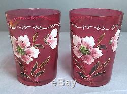A Pair of Victorian Cranberry Glass Floral Enamel Decorated Tumblers