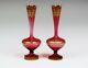 A Pair Of Late 19th Century Bohemian Cranberry Glass Vases Decorated With Gilded