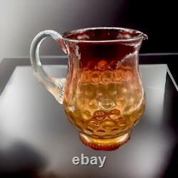 American Victorian Art Glass Amberina Inverted Thumbprint Pitcher. 7 Height