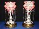 Pair Of Bohemian Cranberry Cased Glass Luster Lamps With Crystal Spear Prisms