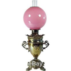 Victorian Banquet Lamp with Lion Heads and Cased Pink Art Glass Globe 1880's